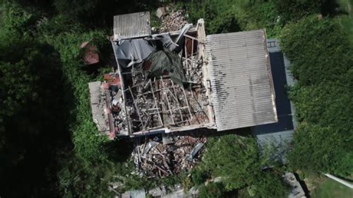 An aerial image shows destroyed homes and businesses along Front Street in Lahaina in the aftermath of wildfires in western Maui, Hawaii on August 10, 2023