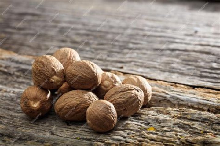 Nutmeg on a wooden surface Nutmeg on a wooden surface